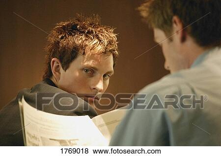 Man looks over his shoulder View Large Photo Image Stock Photo - Man looks over his shoulder. Fotosearch
