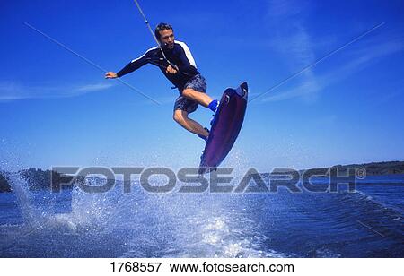 Man wakeboarding on Coal Lake Alberta Canada View Large Photo Image Stock Photo - Man wakeboarding on Coal Lake Alberta Canada. Fotosearch