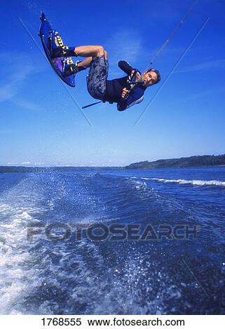 Man wakeboarding on Coal Lake Alberta Canada View Large Photo Image Stock Photography - Man wakeboarding on Coal Lake Alberta Canada. Fotosearch