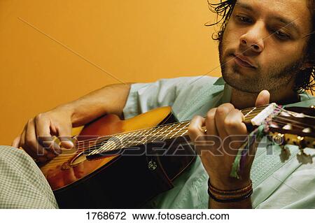 Man with his guitar View Large Photo Image Stock Image - Man with his guitar. Fotosearch