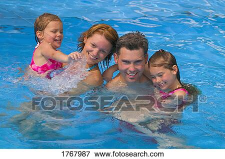 Parents and kids in swimming pool View Large Photo Image Stock Photo - Parents and kids in swimming pool. Fotosearch