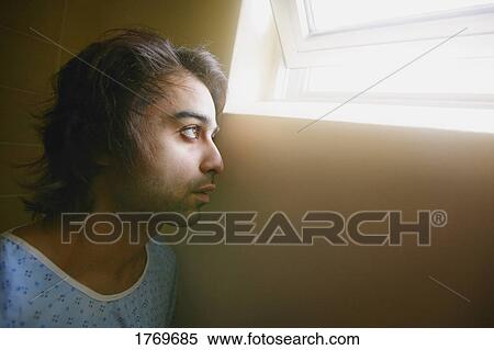 Patient looking out window View Large Photo Image Stock Photography - Patient looking out window. Fotosearch