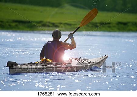 Person in a kayak View Large Photo Image Stock Image - Person in a kayak. Fotosearch