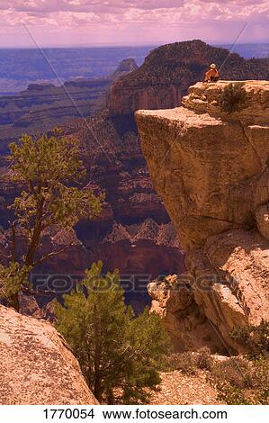 Person on rocky outcrop View Large Photo Image Picture - Person on rocky outcrop. Fotosearch