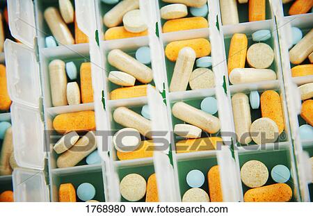Pills in a container View Large Photo Image Stock Image - Pills in a container. Fotosearch