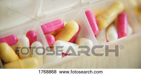 Stock Photo - Pills in a container. Fotosearch