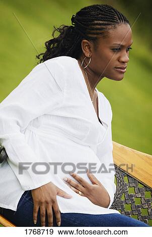 Stock Photo - Portrait of a pregnant mother. Fotosearch