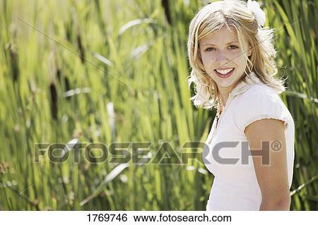 Stock Photograph - Portrait of a young female teenager. Fotosearch