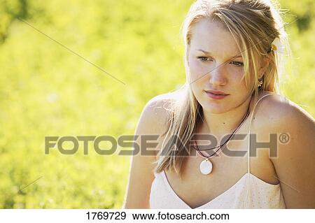 Portrait of a young woman View Large Photo Image Stock Photo - Portrait of a young woman. Fotosearch