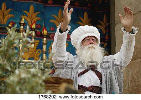 Priest raises his hands toward heaven View Large Photo Image Stock Image - Priest raises his hands toward heaven. Fotosearch