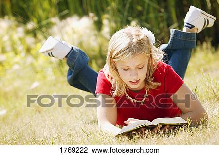Stock Image - Reading a book. Fotosearch