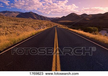 Stock Image - Road going into the distance. Fotosearch