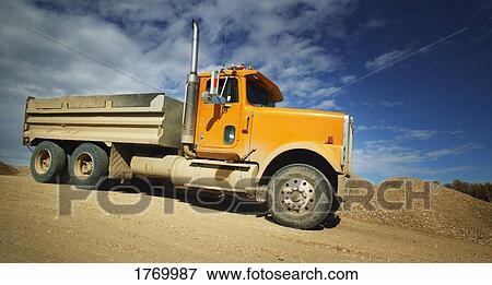 Side view of dump truck View Large Photo Image Stock Photo - Side view of dump truck. Fotosearch
