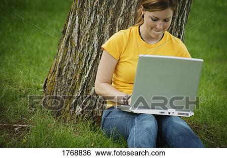 Student works on laptop computer View Large Photo Image Stock Photograph - Student works on laptop computer. Fotosearch