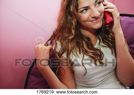 Teenager talks on the phone View Large Photo Image Stock Photo - Teenager talks on the phone. Fotosearch