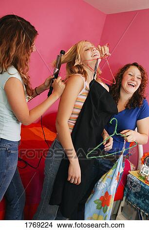 Teenagers getting ready to go out View Large Photo Image Picture - Teenagers getting ready to go out. Fotosearch