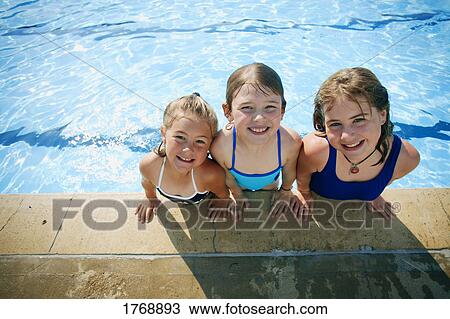 Three girls in a pool View Large Photo Image Stock Image - Three girls in a pool. Fotosearch