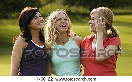 Three women enjoy a laugh View Large Photo Image Stock Image - Three women enjoy a laugh. Fotosearch
