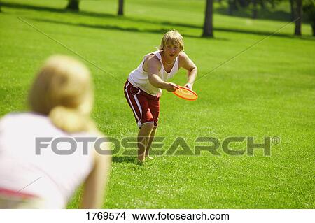Tossing Frisbee View Large Photo Image Picture - Tossing Frisbee. Fotosearch