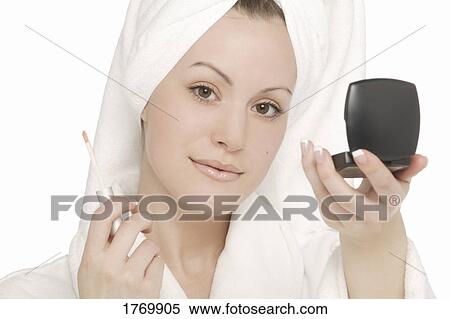Woman applying makeup View Large Photo Image Stock Photography - Woman applying makeup. Fotosearch