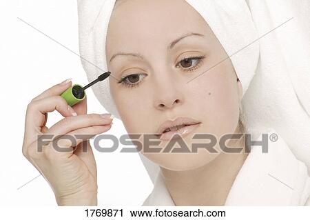 Woman applying mascara View Large Photo Image Stock Image - Woman applying mascara. Fotosearch