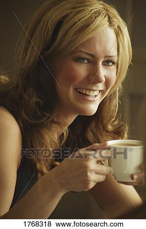 Woman drinks coffee View Large Photo Image Stock Photo - Woman drinks coffee. Fotosearch