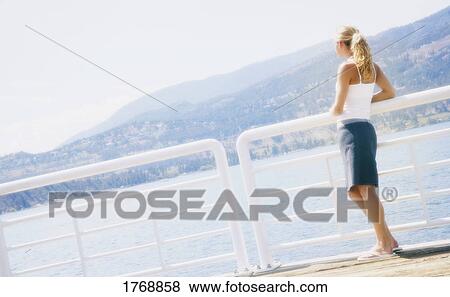 Stock Photo - Woman enjoys the view. Fotosearch