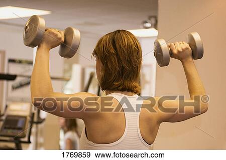 Woman in gym View Large Photo Image Stock Photo - Woman in gym. Fotosearch