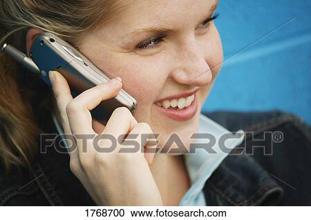 Woman talking on cell phone View Large Photo Image Stock Image - Woman talking on cell phone. Fotosearch