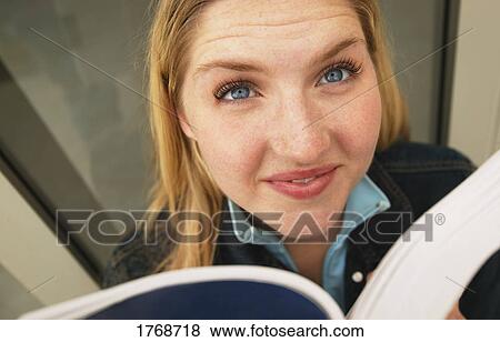 Woman with a book View Large Photo Image Stock Photo - Woman with a book. Fotosearch
