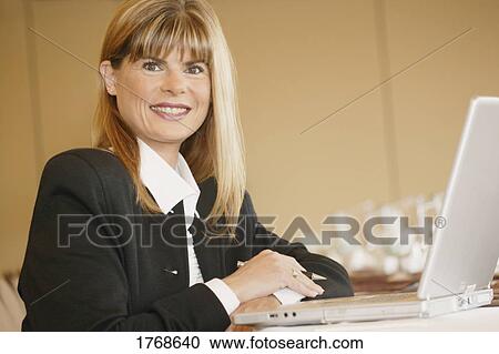 Woman with a laptop computer View Large Photo Image Stock Image - Woman with a laptop computer. Fotosearch