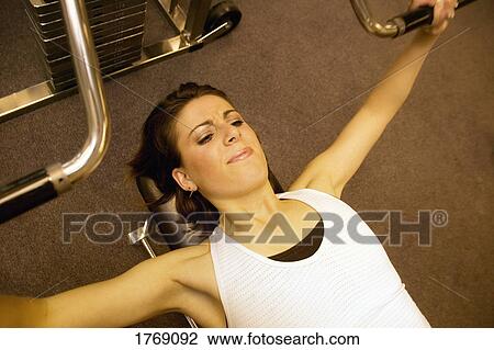 Woman working out View Large Photo Image Stock Image - Woman working out. Fotosearch
