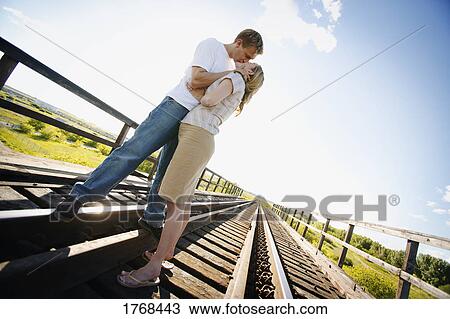young couple kissing View Large Photo Image Stock Image - young couple kissing. Fotosearch