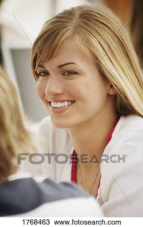 Stock Image - Young woman smiling. Fotosearch