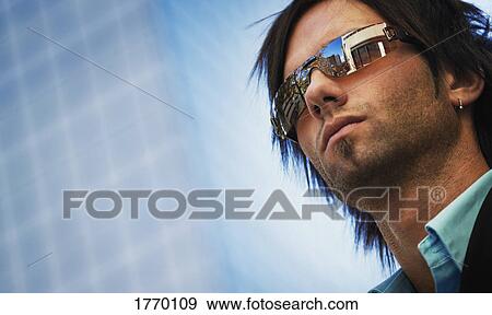 Stock Photo - A man with sunglasses. Fotosearch