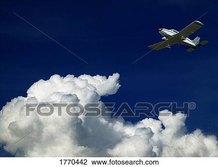 Stock Image - Airplane in sky. Fotosearch
