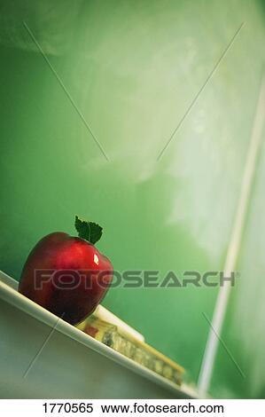 Apple sitting on chalkboard View Large Photo Image Stock Photography - Apple sitting on chalkboard. Fotosearch