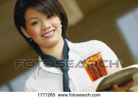 Asian woman carrying drink on tray View Large Photo Image Stock Photography - Asian woman carrying drink on tray. Fotosearch