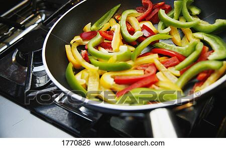 Stock Photograph - Bell Peppers in pan. Fotosearch