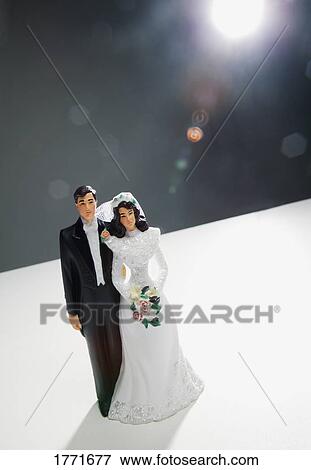 Stock Photo - Bride and groom wedding cake ornament. Fotosearch