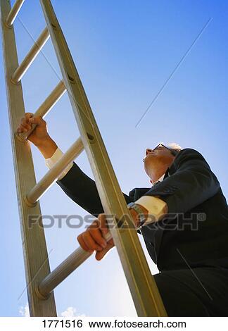 Stock Photograph - Businessman climbing ladder. Fotosearch