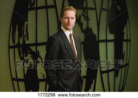 Businessman in front of world map View Large Photo Image Stock Photo - Businessman in front of world map. Fotosearch