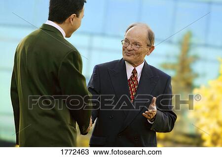 Businessman shaking hands View Large Photo Image Stock Image - Businessman shaking hands. Fotosearch