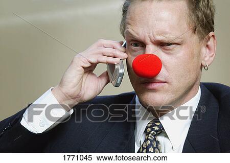 Businessman wearing red nose View Large Photo Image Stock Photography - Businessman wearing red nose. Fotosearch