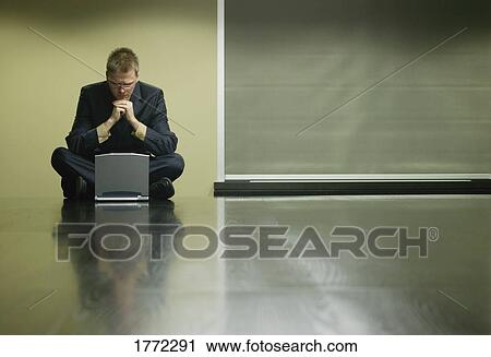 Businessman with laptop View Large Photo Image Stock Image - Businessman with laptop. Fotosearch