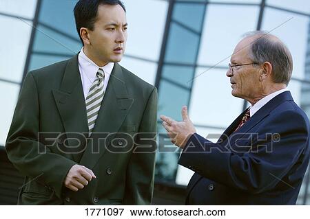 Businessmen in discussion View Large Photo Image Stock Photo - Businessmen in discussion. Fotosearch