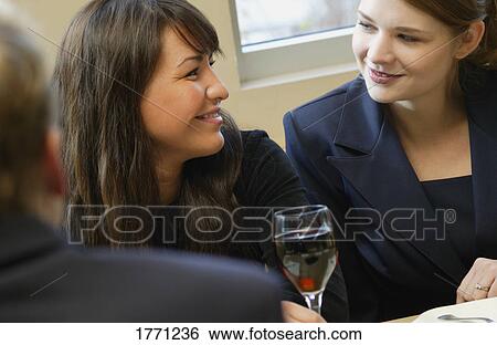 Businesswomen gathering together View Large Photo Image Stock Photograph - Businesswomen gathering together. Fotosearch