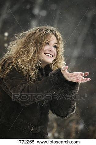 Stock Photography - catching snowflakes. Fotosearch