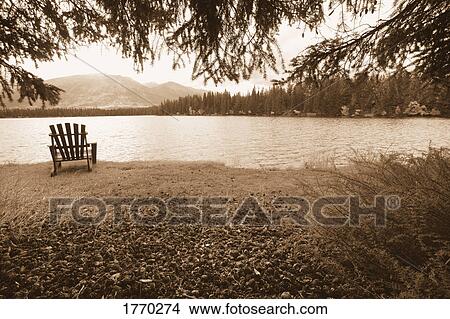 Chair by a lake View Large Photo Image Picture - Chair by a lake. Fotosearch