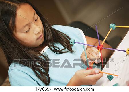 Child building with tinker toys View Large Photo Image Stock Photo - Child building with tinker toys. Fotosearch